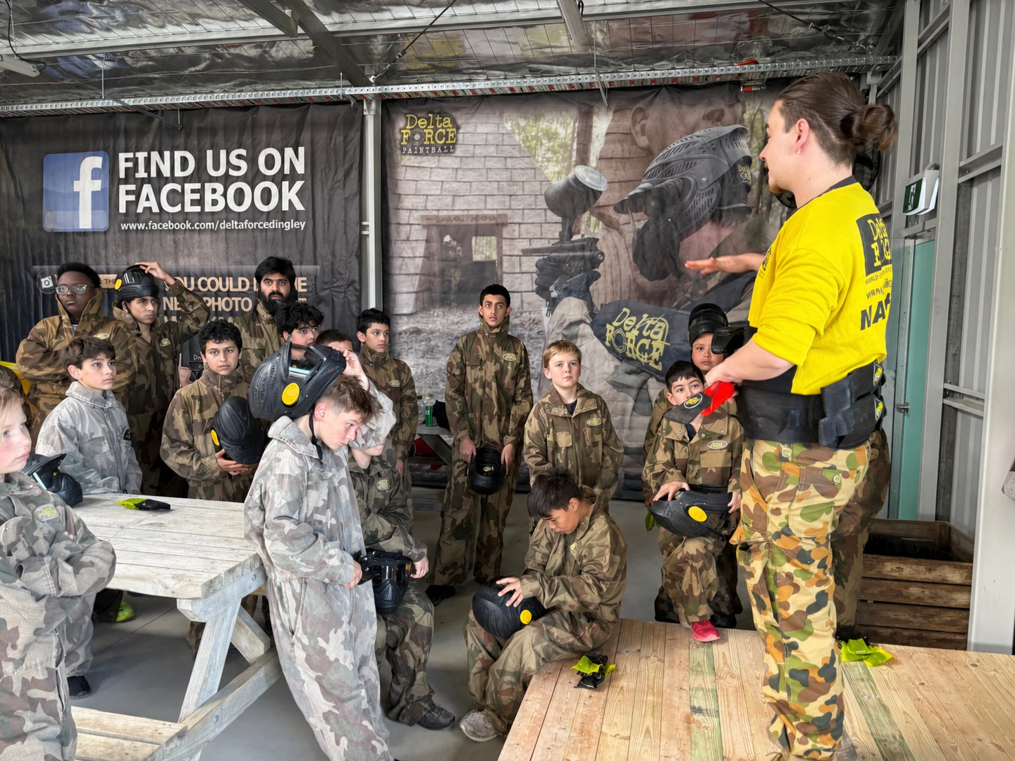A Delta Force Dingley marshal briefing young players before their session